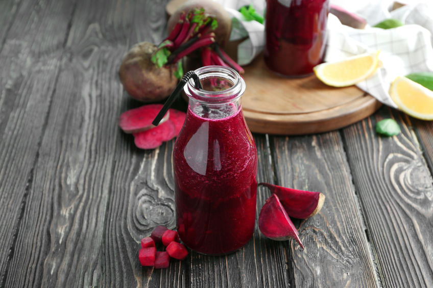 Healthy smoothie with beet root on wooden table