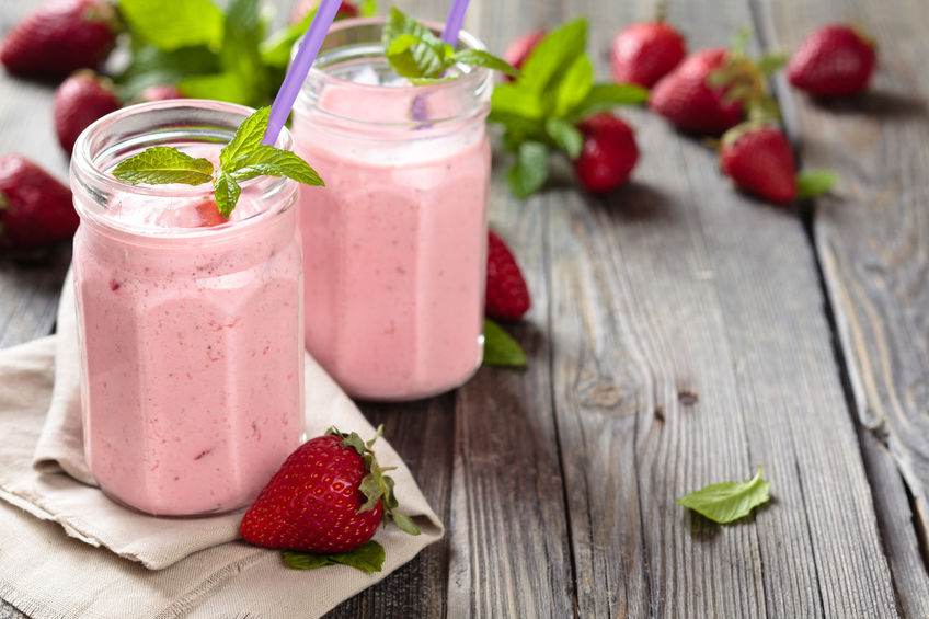 43042059 fruit smoothie with mint leaves on wooden rustic table.