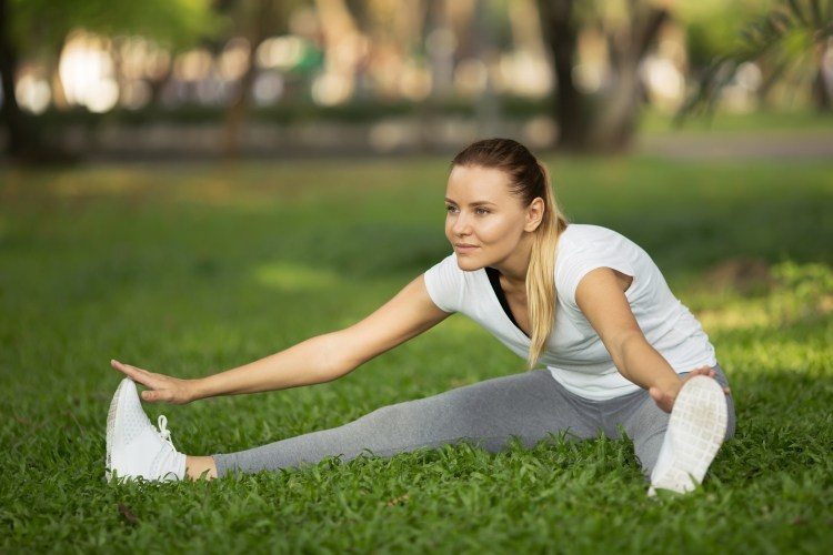 fitness girl expert active recovery in park
