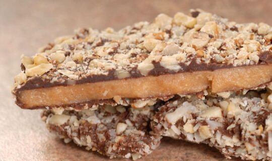 14255923 delicious dark chocolate english toffee with chopped pecan nuts